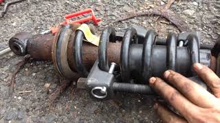 How to change front shocks on 2005  2010 Nissan Pathfinder [upl. by Aleil940]